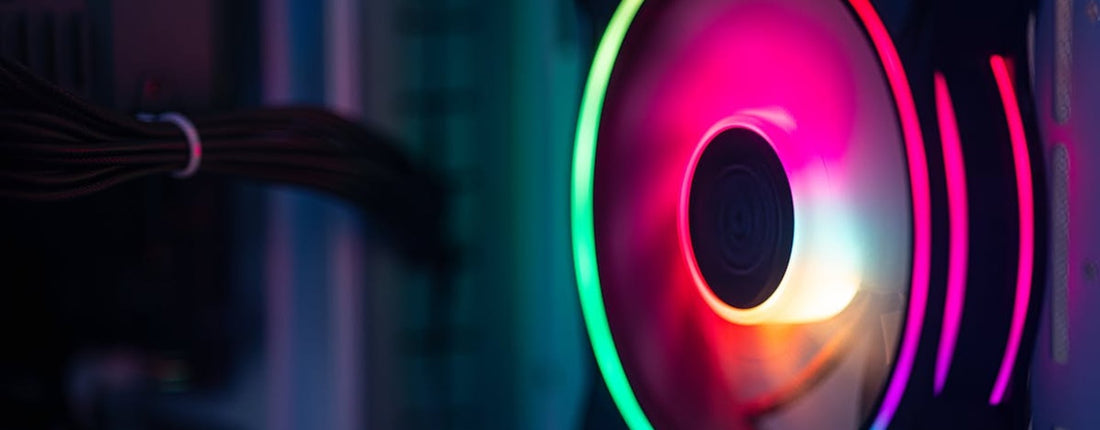 Close-up of a colorful RGB cooling fan in a gaming PC setup.