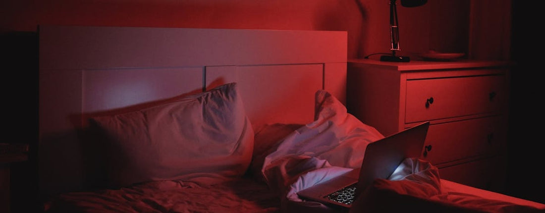 A person comfortably watching Netflix on a laptop, demonstrating effective cooling the laptop on a stable surface.