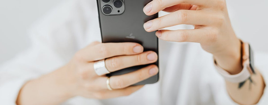 A creator's smartphone setup on a desk, ready for video production, highlighting the need for a creator cooling guide.