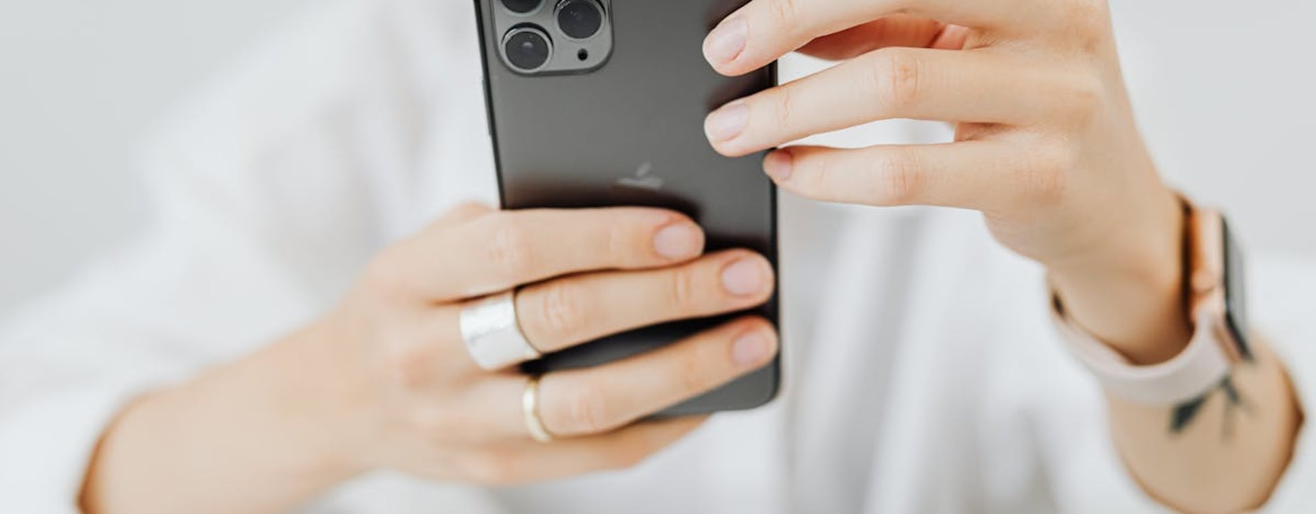 A creator's smartphone setup on a desk, ready for video production, highlighting the need for a creator cooling guide.