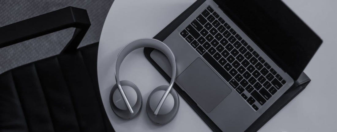 A developer intensely focused on their MacBook Pro, managing complex Xcode builds and monitoring MacBook Pro M3 Max thermal performance.