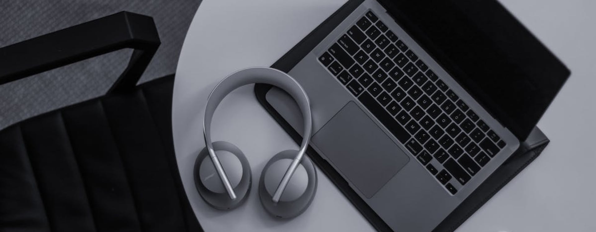 A developer intensely focused on their MacBook Pro, managing complex Xcode builds and monitoring MacBook Pro M3 Max thermal performance.