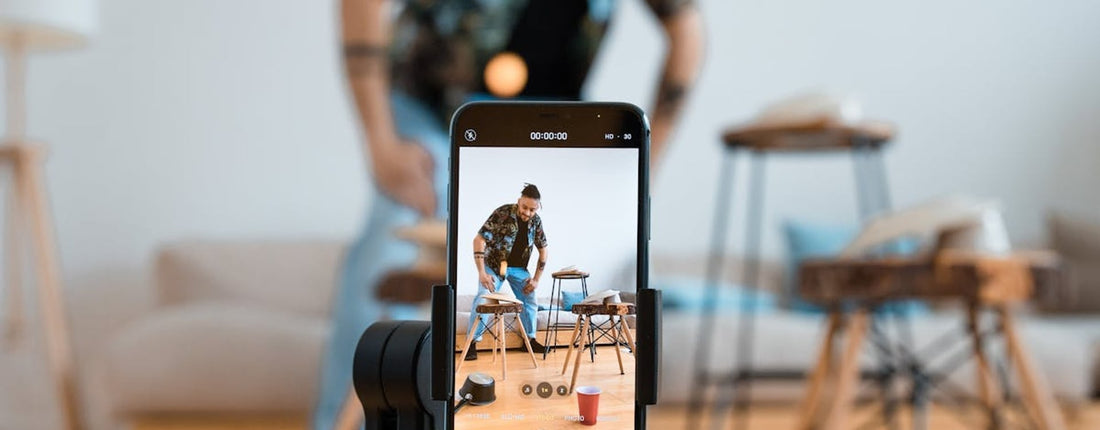 A streamer setting up their phone for a live broadcast, highlighting the need for a phone cooler for live streaming to prevent overheating.