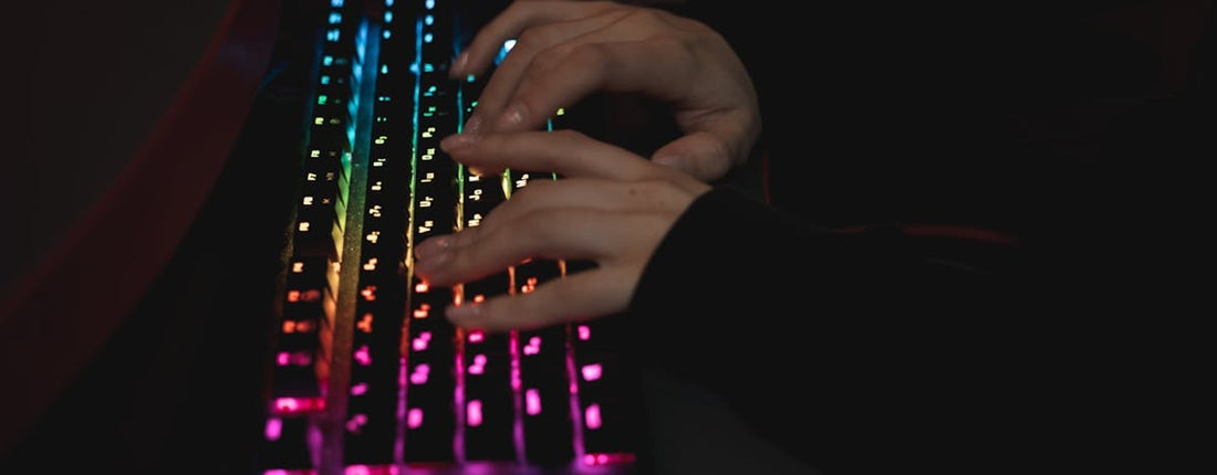 A gaming laptop on a desk, running a demanding application, highlighting the need for effective thermal management and PTM7950 install.