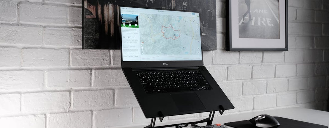 A gamer focused on their high-performance gaming laptop, illuminated by the screen's glow, optimizing their throttlestop gaming laptop settings.