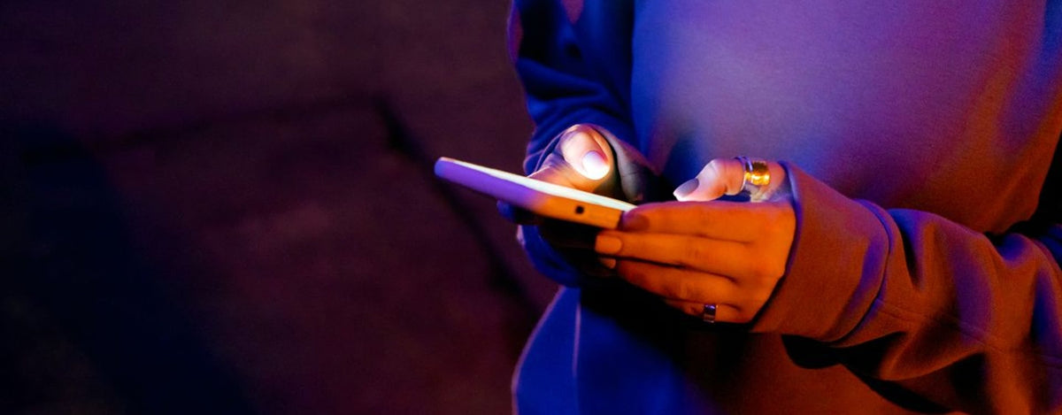 Dim gaming desk with warm and cool ambient light, illustrating Android game resolution and smoothness choices